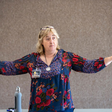 Nancy Solook, CHt, teaching in front of a training group